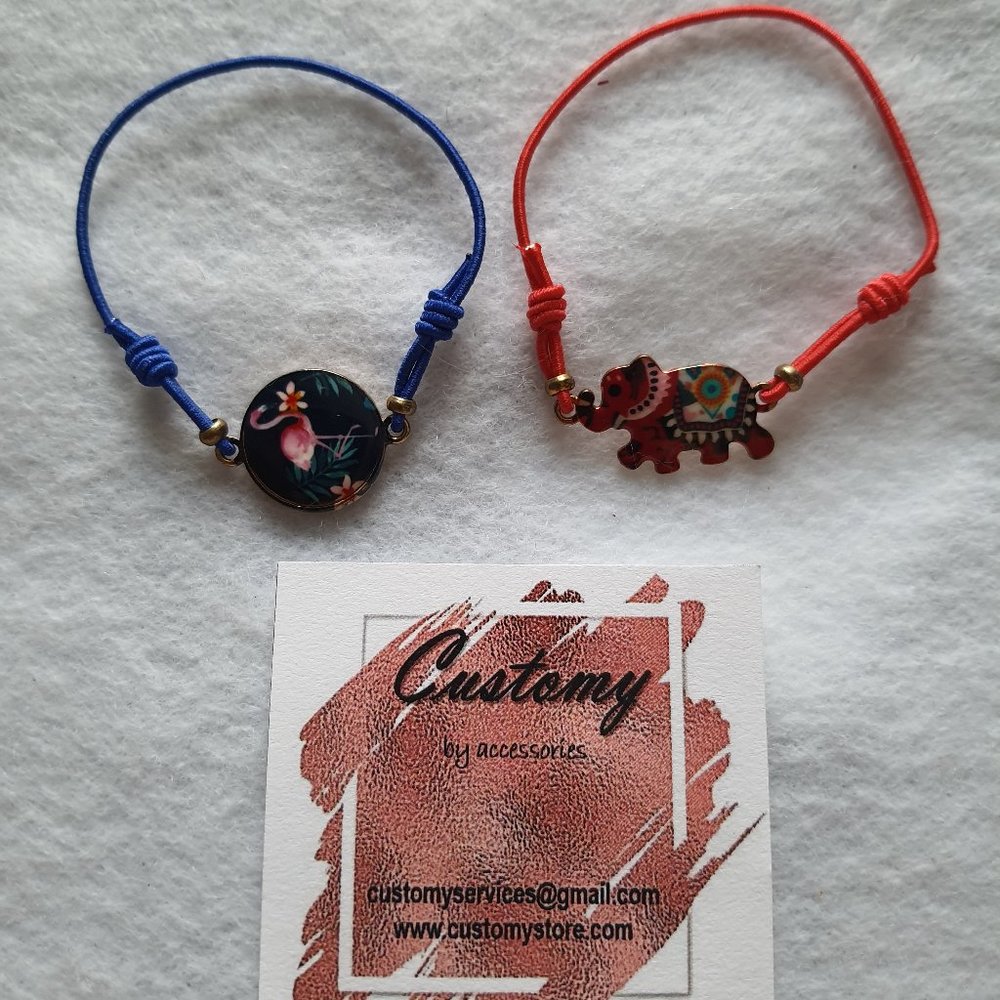 2 THREAD BRACELETS RED AND BLUE - ELEPHANT AND FLA